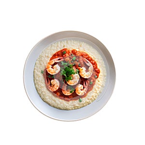 Shrimp and grits with a spicy tomato sauce, viewed from above, with a hint of scallions and parsley. isolated on