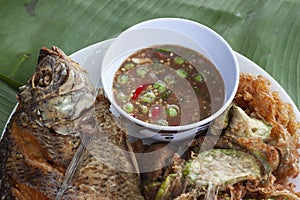 Shrimp Paste Chili Sauce, Fried tilapia and Eggplant wattle omelettes Thai people call Nam Prik Kapi. photo