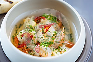 Shrimp pil-pil. King prawns, garlic, chilli and baguette. Delicious Spanish traditional food closeup served for lunch in