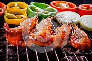 Shrimp,prawns grilled on barbecue fire stove with chilly onion f