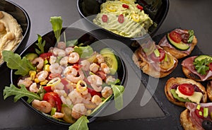 Shrimp salad, guacamole and open sandwiches