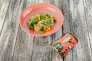 Shrimp salad in a plate on an isolated background