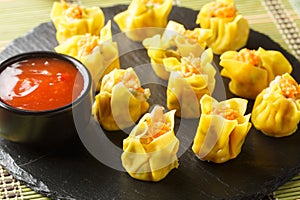 Shrimp shumai also pronounced siu mai or shao mai are a popular Cantonese steamed dumpling often served at Chinese closeup.