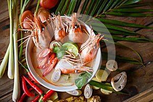 Shrimp soup on seafood soup bowl with thai herb and spices, Thai Food Tom Yum Kung, Hot and sour spicy shrimps prawns soup curry