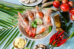 Shrimp soup on seafood soup bowl with thai herb and spices, Thai Food Tom Yum Kung, Hot and sour spicy shrimps prawns soup curry