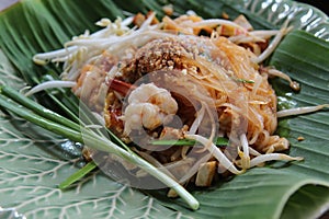 Shrimp stir fried rice noodles on banana leaf