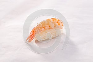Shrimp sushi Ebi Nigiri on white crumpled paper background