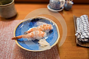shrimp sushi on wooden table of Japanese restaurant in Karatsu