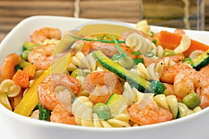 Shrimp and vegetables fusilli pasta salad close