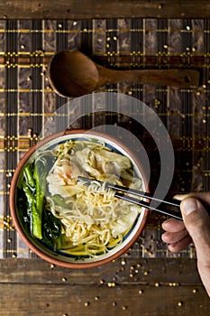 Shrimp wonton noodle soup with choy sum