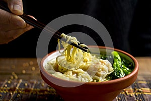 Shrimp wonton noodle soup with choy sum