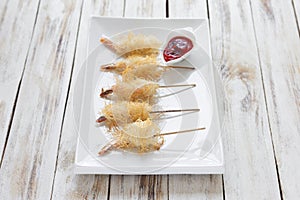 Shrimp wrapped in dough Kataifi called also Kanafeh, Kadaif. photo