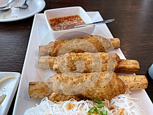 Shrimp wrapped in sugar cane, a popular Vietnamese dish made from peeled shrimp and finely chopped.