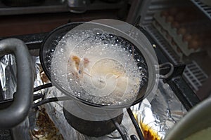 Shrimps boil in metallic bowl photo