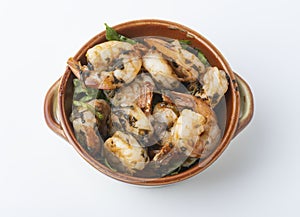 Shrimps provencal, Shrimp in Provencal in a pot  on white