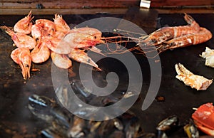 Shrimps sea food and mussels on the black background