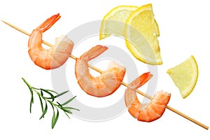 shrimps skewers with lemon and rosemary isolated on a white background. top view