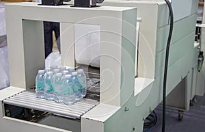 Shrink film wrapping machine