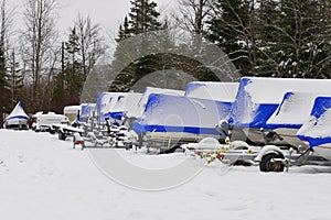 Shrink wrapped boats in snow photo