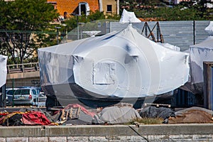 Shrink-wrapped boats stored ashore and winterized