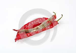 Shrinking and mouldy chili peppers photo