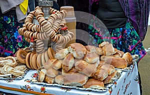 Shrovetide Maslenitsa Butter Week festival meal. Stack of russian pancakes. Russian tea samovar with a bunch of bagels