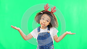 Shrug, green screen and face of a child with a gesture isolated on a studio background. Confused, doubt and a portrait