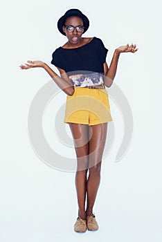 Shrugging, question and portrait of woman with fashion and confused with choice in studio background. Thinking, why and