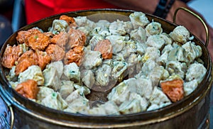 `Shumai`  a `Dim Sum` Chinese traditional steamed dumplings food with shrimp and pork inside