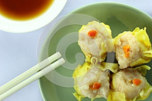 Shumai , siu mai - chinese steamed pork dumplings on white background