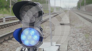 Shunting railway traffic light with changing white and blue signal