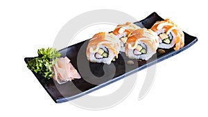 Shushi serve in black Japanese plate isolated over white background