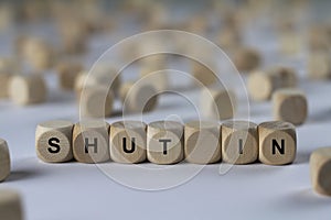Shut in - cube with letters, sign with wooden cubes