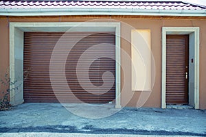 Shutter door or roller door and concrete floor outside .White Automatic shutters in a house . gates in the garage . Automatic