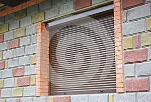 Shutter security barrier. Window with rolling shutter for house protection. Security Shutters Grilles.