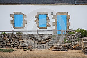 The shutters of this house situated in Brittany, France, were painted in blue