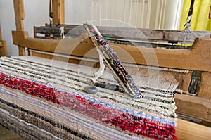 Shuttle on the antique loom and thread