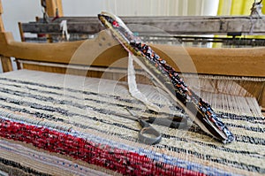 Shuttle on the antique loom and thread