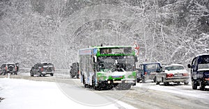 Shuttle bus on the road in the snow