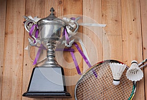 Shuttlecocks, rackets and badminton trophy