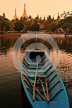 Shwe Dagon Pagoda at sunset, blue boat