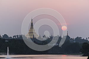 Shwedagon Pagoda with sunset sky from Kandawgyi Lake, Yangon, My