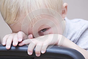 Shy Baby Boy Peeking Over Chair