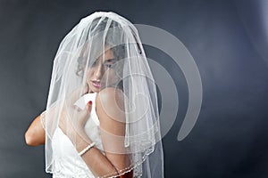 Shy bride with veil