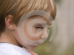 Shy Child with Blue Green Eyes