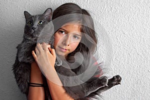 Shy Girl Holding Forlorn Grey Cat