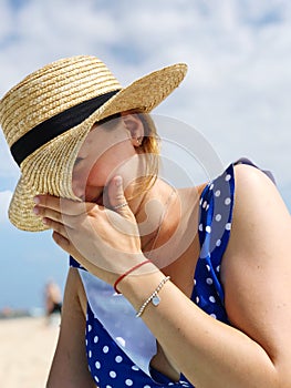 Shy hat at the beach