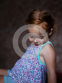 Shy little ginger girl embarrassed portrait