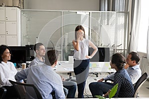 Shy nervous worker embarrassed afraid of speaking at corporate m photo