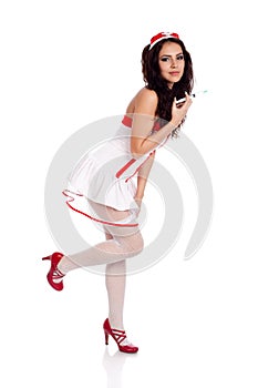 Shy nurse holding a leg up